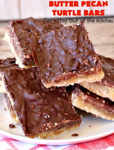 Butter Pecan Turtle Bars | These amazing layered #cookies have a shortbread crust. They're topped with #pecans & a homemade #caramel layer. Then they're covered with #chocolatechips while hot. That layer is spread into a delicious #chocolate icing. Perfect for #tailgating parties, soccer games, backyard barbecues, baby showers or potlucks. #ChocolateDessert #ButterPecanDessert #TurtleDessert #TurtleBars