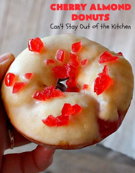 Cherry Almond Donuts | Can't Stay Out of the Kitchen | these luscious #donuts are filled with #cherries & #almond extract. They're glazed with an almond-flavored powdered sugar icing & topped with chopped cherries. Perfect for #ValentinesDay or any #holiday #breakfast. #HolidayBreakfast #ValentinesDayBreakfast #CherryDonuts #CherryAlmondDonuts 