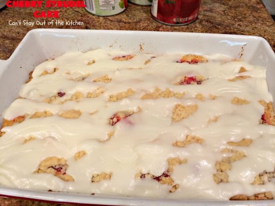 Cherry Strudel Cake | Can't Stay Out of the Kitchen | this rich, decadent #cake is absolutely divine! It's perfect for either a #holiday #breakfast or for #dessert. It uses #CherryPieFilling in the middle, a streusel topping & icing with #almond extract. Tastes like eating #CherryStrudel but so much easier! #coffeecake #CherryCoffeecake #CherryCake #Brunch #HolidayBreakfast #CherryDessert #CherryStrudelCake