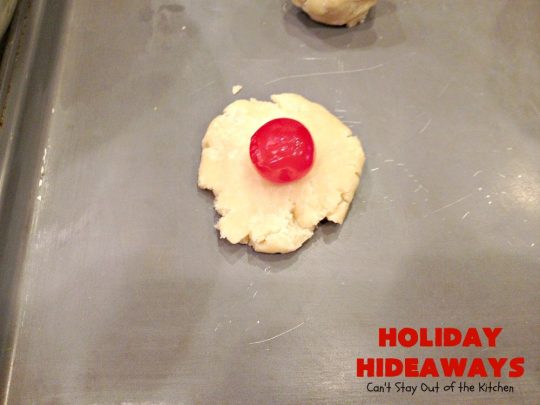 Holiday Hideaways | Can't Stay Out of the Kitchen | these scrumptious #cookies have a #maraschinocherry hidden inside each one! Then they're dunked in #chocolate or #vanilla bark before sprinkling with additional bark shavings. So festive & beautiful for #holiday or #Christmas #baking. #Christmas #ChristmasDessert #ChristmasCookieExchange #cherries #ChocolateDessert #CherryDessert #dessert