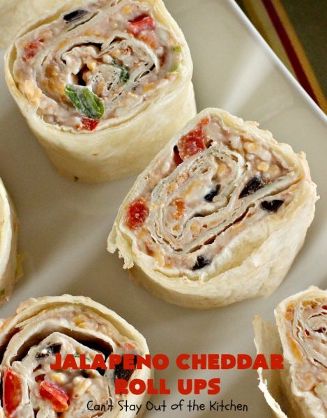 Jalapeno Cheddar Roll Ups | Can't Stay Out of the Kitchen | these fantastic #TexMex #appetizers are terrific for #tailgating, #NewYearsEve or #SuperBowl parties. Filled with #refriedbeans, #chilies, #olives, & lots of #cheese.