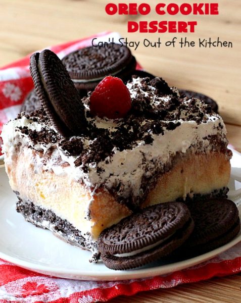 Oreo Cookie Dessert | Can't Stay Out of the Kitchen | This spectacular #dessert is rich, decadent & so addictive! No one will want only one piece! The bottom layer is crushed #Oreos. Layered with #BlueBell vanilla ice cream, then it has a homemade #fudge & walnut sauce. It's topped with #CoolWhip & more #Oreos. #OreoDessert #ChocolateDessert #IceCreamDessert #FudgeDessert #ValentinesDayDessert #HolidayDessert