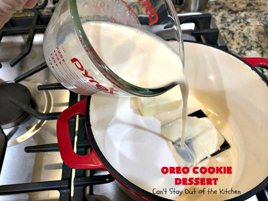 Oreo Cookie Dessert | Can't Stay Out of the Kitchen | This spectacular #dessert is rich, decadent & so addictive! No one will want only one piece! The bottom layer is crushed #Oreos. Layered with #BlueBell vanilla ice cream, then it has a homemade #fudge & walnut sauce. It's topped with #CoolWhip & more #Oreos. #OreoDessert #ChocolateDessert #IceCreamDessert #FudgeDessert #ValentinesDayDessert #HolidayDessert