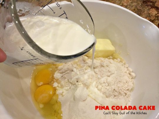 Pina Colada Cake | Can't Stay Out of the Kitchen | Best #PinaColada cake ever! This amazing #pokecake uses cream of coconut & sweetened condensed milk to make it exceptionally moist. It's terrific for potlucks, special occasions & #holidays. 