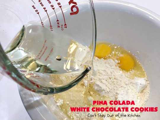 Pina Colada White Chocolate Cookies | Can't Stay Out of the Kitchen | this quick & easy 5-ingredient #cookie is crazy good! You can have #dessert made in about 30 minutes with this simple #recipe. If you enjoy the flavor of #PinaColadas you'll love these cookies. #Pineapple #Coconut #WhiteChocolateChips #chocolate #PinaColada #PinaColadaWhiteChocolateCookies #PinaColadaDessert #ChocolateDessert #PineappleDessert #tailgating