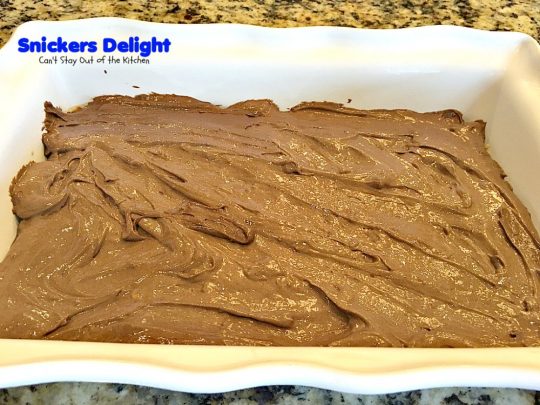 Snickers Delight | Can't Stay Out of the Kitchen | fantastic #icecream #dessert with a graham cracker crust, a #snickers ice cream & #chocolate pudding layer & topped with chopped Snickers bars. This will become your favorite dessert!