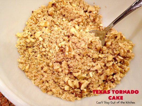 Texas Tornado Cake | Can't Stay Out of the Kitchen | this quick & easy #cake #recipe looks like a tornado hit it after baking! It's filled with #walnuts and #FruitCocktail. The #caramelized icing contains #coconut. This vintage cake will knock your socks off! #dessert #TexasTornadoCake #FruitCocktailCake #peaches #pears #EasyDessertRecipe #Holiday #HolidayDessert #ValentinesDay #ValentinesDayDessert