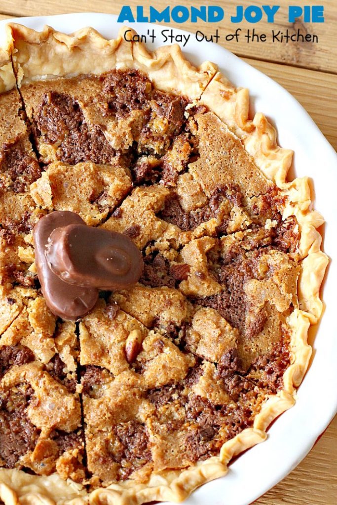Almond Joy Pie | Can't Stay Out of the Kitchen | this fantastic #pie is filled with #AlmondJoyBars. So it's loaded with #chocolate, #coconut & #almonds. Every bite is breathtaking. Great #dessert for company or #holidays like #ValentinesDay. #HolidayDessert #ValentinesDayDessert #AlmondJoyDessert #AlmondJoyPie #ChocolateDessert #CoconutDessert #AlmondDessert