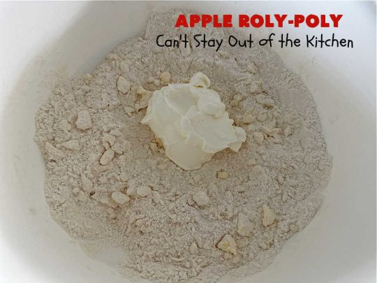 Apply Roly-Poly | Can't Stay Out of the Kitchen | #AppleRolyPoly is one of the best #desserts you'll ever sink your teeth into. This #cobbler-type #dessert rolls up like #PieCrust & is sliced into #pinwheels. It has a #cinnamon #syrup poured over top before #baking. The result has a #cake-like texture & is beyond spectacular. Excellent served with #IceCream. #apples #AppleDessert #AppleCobbler