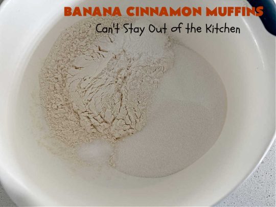 Banana Cinnamon Muffins | Can't Stay Out of the Kitchen | #Cinnamon flavor explodes in these lovely #muffins due to the addition of #CinnamonChips in the batter. They're sure to cure any sweet tooth craving although you may want seconds! #Applesauce & #bananas keep these #breakfast #muffins moist. Great choice for a weekday, company or #holiday #breakfast or #brunch. #BananaCinnamonMuffins