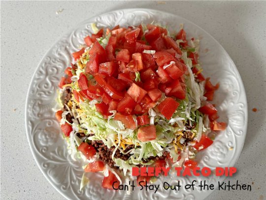 Beefy Taco Dip | Can't Stay Out of the Kitchen | #BeefyTacoDip is a sensational #TexMex #appetizer. This is a #LayeredDip with a #CreamCheese layer, a #GroundBeef layer with #TacoSeasoning & then it's topped with #lettuce, #tomatoes, #GreenOnions & #BellPeppers. Serve with #Fritos or #TortillaChips. Great for #tailgating parties, backyard barbecues or potlucks. #GlutenFree