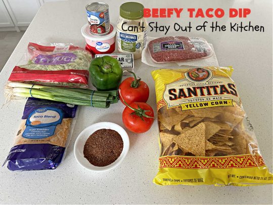 Beefy Taco Dip | Can't Stay Out of the Kitchen | #BeefyTacoDip is a sensational #TexMex #appetizer. This is a #LayeredDip with a #CreamCheese layer, a #GroundBeef layer with #TacoSeasoning & then it's topped with #lettuce, #tomatoes, #GreenOnions & #BellPeppers. Serve with #Fritos or #TortillaChips. Great for #tailgating parties, backyard barbecues or potlucks. #GlutenFree