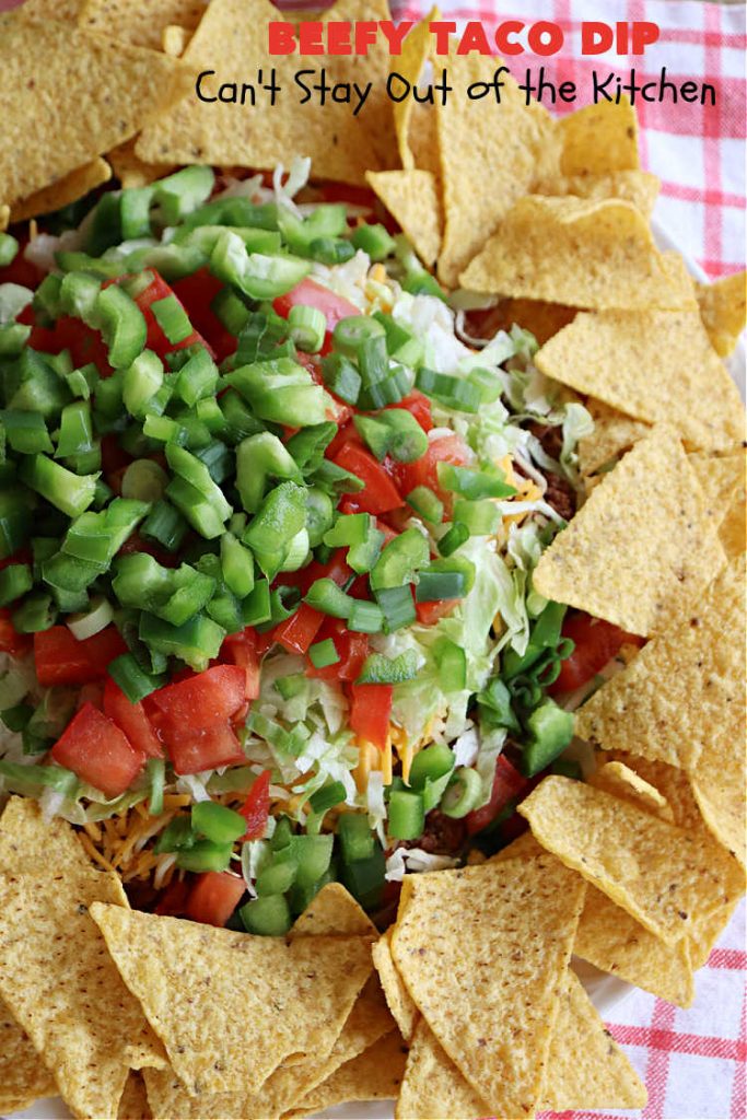 Beefy Taco Dip | Can't Stay Out of the Kitchen | #BeefyTacoDip is a sensational #TexMex #appetizer. This is a #LayeredDip with a #CreamCheese layer, a #GroundBeef layer with #TacoSeasoning & then it's topped with #lettuce, #tomatoes, #GreenOnions & #BellPeppers. Serve with #Fritos or #TortillaChips. Great for #tailgating parties, backyard barbecues or potlucks. #GlutenFree