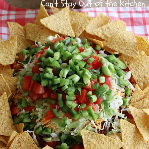 Beefy Taco Dip | Can't Stay Out of the Kitchen | #BeefyTacoDip is a sensational #TexMex #appetizer. This is a #LayeredDip with a #CreamCheese layer, a #GroundBeef layer with #TacoSeasoning & then it's topped with #lettuce, #tomatoes, #GreenOnions & #BellPeppers. Serve with #Fritos or #TortillaChips. Great for #tailgating parties, backyard barbecues or potlucks. #GlutenFree