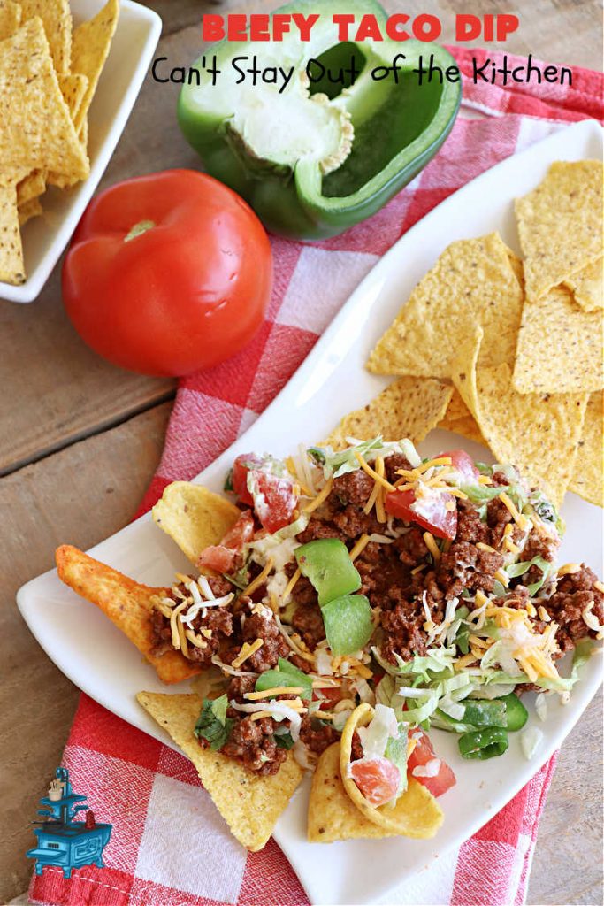 Beefy Taco Dip | Can't Stay Out of the Kitchen | #BeefyTacoDip is a sensational #TexMex #appetizer. This is a #LayeredDip with a #CreamCheese layer, a #GroundBeef layer with #TacoSeasoning & then it's topped with #lettuce, #tomatoes, #GreenOnions & #BellPeppers. Serve with #Fritos or #TortillaChips. Great for #tailgating parties, backyard barbecues or potlucks. #GlutenFree