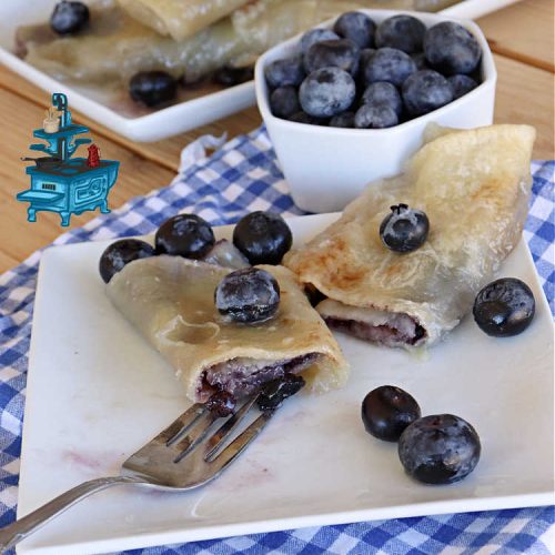 Blueberry Fruit Fajitas | Can't Stay Out of the Kitchen | These lovely #FruitFajitas use #BlueberryPieFilling and are wrapped in #tortillas. Then they're saturated in a lovely syrup before baking. This delightful #recipe is great for #dessert but since they're like #crepes we enjoy them for #breakfast too. #HolidayDessert #BlueberryDessert #CincoDeMayo #Blueberries #BlueberryFruitFajitas