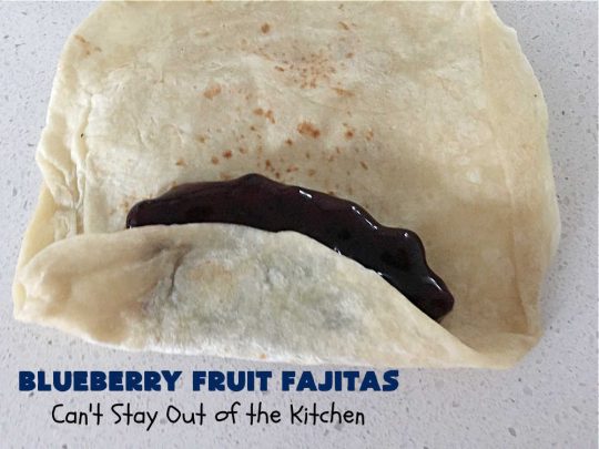 Blueberry Fruit Fajitas | Can't Stay Out of the Kitchen | These lovely #FruitFajitas use #BlueberryPieFilling and are wrapped in #tortillas. Then they're saturated in a lovely syrup before baking. This delightful #recipe is great for #dessert but since they're like #crepes we enjoy them for #breakfast too. #HolidayDessert #BlueberryDessert #CincoDeMayo #Blueberries #BlueberryFruitFajitas