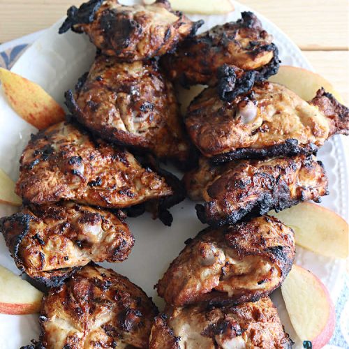 Bombay Chicken Thighs | Can't Stay Out of the Kitchen | this delightful #chicken #entree has the flavors of #India without the excessive spiciness that you might expect. The #chicken is marinated overnight in a #GreekYogurt sauce which tamps down the spicy seasonings leaving a milder, & very satisfying blend of flavors. The #ChickenThighs are grilled adding the smoky flavors from the #grill. The scrumptious combination of flavors is irresistible. #GlutenFree #Bombay #BombayChicken #BombayChickenThighs