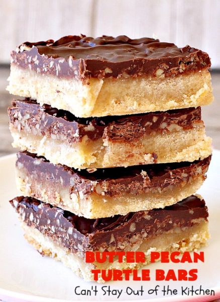 Butter Pecan Turtle Bars | These amazing layered #cookies have a shortbread crust. They're topped with #pecans & a homemade #caramel layer. Then they're covered with #chocolatechips while hot. That layer is spread into a delicious #chocolate icing. Perfect for #tailgating parties, soccer games, backyard barbecues, baby showers or potlucks. #ChocolateDessert #ButterPecanDessert #TurtleDessert #TurtleBars