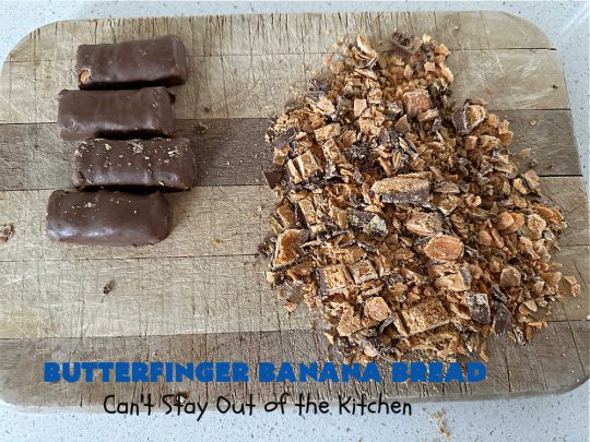 Butterfinger Banana Bread | Can't Stay Out of the Kitchen | No one will be able to resist this outrageous #ButterfingerBananaBread #recipe! It's fantastic for a weekend, company or #holiday #breakfast or #brunch. Every bite is chocked full of #Butterfingers so it has those great #chocolaty & #PeanutButter flavors that everyone loves. The rich, decadent #chocolate icing makes it even better! #SweetBread #ButterfingerCandyBars #ButterfingerCandy