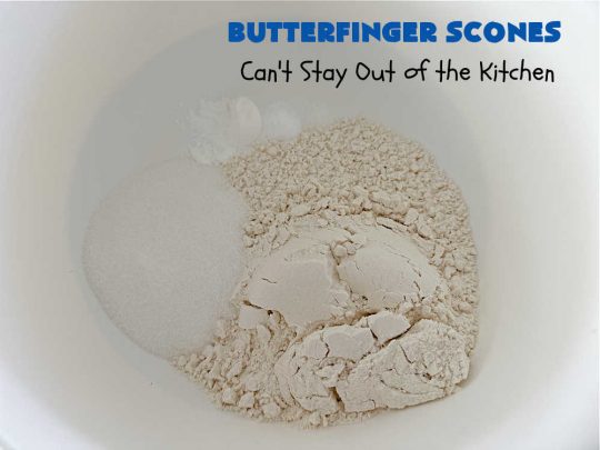 Butterfinger Scones | Can't Stay Out of the Kitchen | Delight your family & friends with these spectacular #ButterfingerScones on your next #breakfast buffet. After just one bite they'll be swooning. These luscious #scones are sweeter than the traditional variety & include #Butterfingers & a luscious #chocolate #icing with more #ButterfingerCandyBars sprinkled over top. Perfect for a weekend, company or #holiday breakfast. Utterly irresistible! #chocolate #PeanutButter #HolidayBreakfast