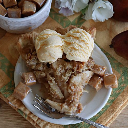 Caramel Pear Pie | Can't Stay Out of the Kitchen | this luscious #PearPie #recipe includes a layer of melted #caramels, #pecans & an #oatmeal #streusel topping that's totally scrumptious. Prepare to swoon over every bite. If you thought #CandiedApples were great, try this #pie version with #pears. Great for #holidays & company. #dessert #PearDessert #CaramelPearPie