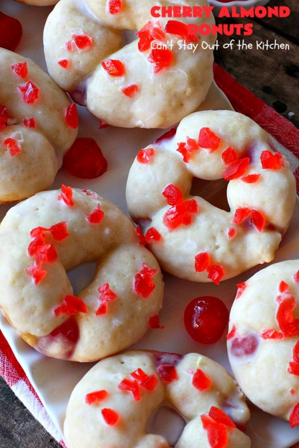 Cherry Almond Donuts | Can't Stay Out of the Kitchen | these luscious #donuts are filled with #cherries & #almond extract. They're glazed with an almond-flavored powdered sugar icing & topped with chopped cherries. Perfect for #ValentinesDay or any #holiday #breakfast. #HolidayBreakfast #ValentinesDayBreakfast #CherryDonuts #CherryAlmondDonuts