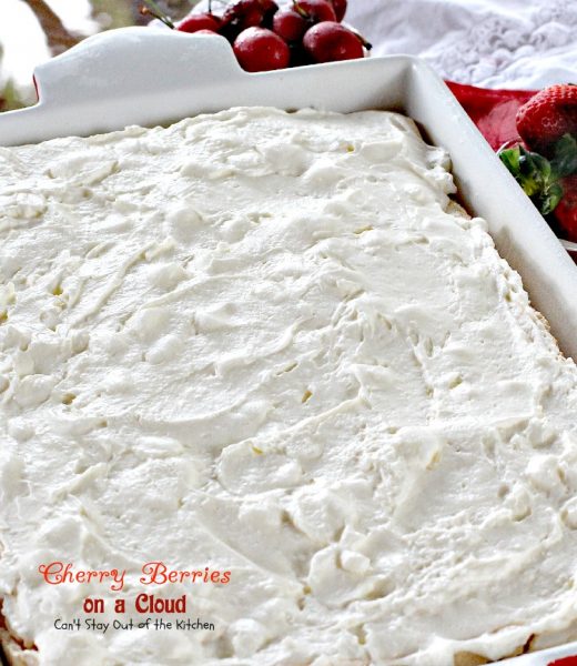 Cherry Berries on a Cloud | Can't Stay Out of the Kitchen | we love this absolutely spectacular #dessert that's great for the #holidays. This one has a #meringue crust, a #marshmallow and #creamcheese layer and topped with #cherrypiefilling and #strawberries.