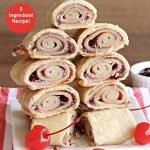 Cherry Pie Crust Cinnamon Rolls | Can't Stay Out of the Kitchen | You'll be swooning over every bite of these luscious #PieCrustCinnamonRolls. These include #CherryPreserves so they are doubly delicious. Great sweet treat for #breakfast or #brunch menus. This quick & easy #5IngredientRecipe can be whipped up in a jiffy so these #CinnamonRolls can be enjoyed all day long! #cherries #CherryPieCrustCinnamonRolls