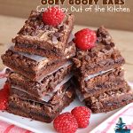 Chocolate Ooey Gooey Bars | Can't Stay Out of the Kitchen | You'll be raving over every drool-worthy bite of these fantastic #OoeyGooeyBars. They're made with 3 kinds of #chocolate & just ooze deliciousness in every bite. The #Cheesecake layer alone will leave you swooning! #cookie #brownie #tailgating #dessert, #CreamCheese #ChocolateChips #ChocolateDessert #HolidayDessert #OoeyGooeyDessert #ChocolateOoeyGooeyBars