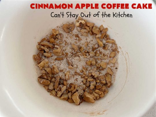 Cinnamon Apple Coffee Cake | Can't Stay Out of the Kitchen | Captivate your senses with this amazing #AppleCoffeeCake #recipe. This lovely, moist #CoffeeCake has 2 layers of #cake batter, 2 layers of #cinnamon #walnut #streusel topping & a layer of grated #apples in the center. It uses a #CakeMix & #Cheesecake pudding mix so it's not difficult to whip up. Great #cake for #dessert or for #breakfast! #holiday #HolidayBreakfast #AppleDessert #CinnamonAppleCoffeeCake