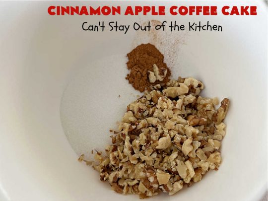 Cinnamon Apple Coffee Cake | Can't Stay Out of the Kitchen | Captivate your senses with this amazing #AppleCoffeeCake #recipe. This lovely, moist #CoffeeCake has 2 layers of #cake batter, 2 layers of #cinnamon #walnut #streusel topping & a layer of grated #apples in the center. It uses a #CakeMix & #Cheesecake pudding mix so it's not difficult to whip up. Great #cake for #dessert or for #breakfast! #holiday #HolidayBreakfast #AppleDessert #CinnamonAppleCoffeeCake