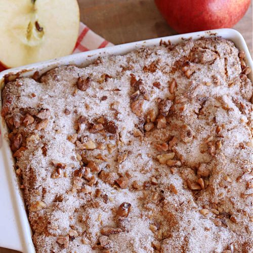 Cinnamon Apple Coffee Cake | Can't Stay Out of the Kitchen | Captivate your senses with this amazing #AppleCoffeeCake #recipe. This lovely, moist #CoffeeCake has 2 layers of #cake batter, 2 layers of #cinnamon #walnut #streusel topping & a layer of grated #apples in the center. It uses a #CakeMix & #Cheesecake pudding mix so it's not difficult to whip up. Great #cake for #dessert or for #breakfast! #holiday #HolidayBreakfast #AppleDessert #CinnamonAppleCoffeeCake