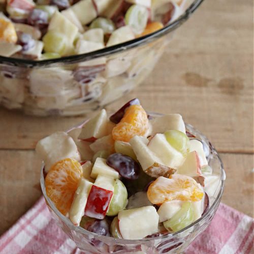 Company Fruit Salad | Can't Stay Out of the Kitchen | This delicious #FruitSalad will rock your world! It's made with #pears, #pineapple, #grapes #MandarinOranges & #apples & uses a very easy #CreamCheese #SaladDressing to mix it all together. It's the perfect #salad for company or #holiday dinners, but simple enough to whip up for everyday meals. Everyone will want seconds! #GlutenFree #CompanyFruitSalad