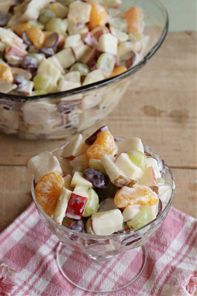 Company Fruit Salad | Can't Stay Out of the Kitchen | This delicious #FruitSalad will rock your world! It's made with #pears, #pineapple, #grapes #MandarinOranges & #apples & uses a very easy #CreamCheese #SaladDressing to mix it all together. It's the perfect #salad for company or #holiday dinners, but simple enough to whip up for everyday meals. Everyone will want seconds! #GlutenFree #CompanyFruitSalad