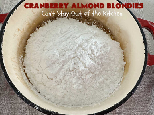 Cranberry Almond Blondies | Can't Stay Out of the Kitchen | these lovely #brownies simply explode with flavor. #AlmondExtract & #almonds in the #brownie & the #icing make them sing! #BrownedButter, #bananas, #DriedCranberries & #VanillaChips sweeten up the #blondies so they're rich, decadent & irresistible. Perfect for #holiday parties, #tailgating & #potlucks. #CranberryAlmondBlondies