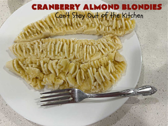 Cranberry Almond Blondies | Can't Stay Out of the Kitchen | these lovely #brownies simply explode with flavor. #AlmondExtract & #almonds in the #brownie & the #icing make them sing! #BrownedButter, #bananas, #DriedCranberries & #VanillaChips sweeten up the #blondies so they're rich, decadent & irresistible. Perfect for #holiday parties, #tailgating & #potlucks. #CranberryAlmondBlondies