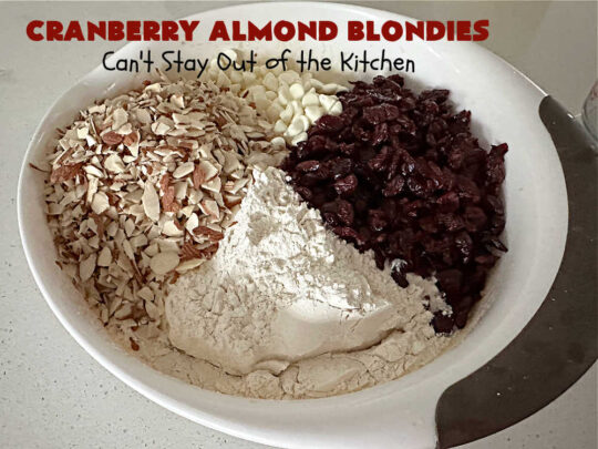 Cranberry Almond Blondies | Can't Stay Out of the Kitchen | these lovely #brownies simply explode with flavor. #AlmondExtract & #almonds in the #brownie & the #icing make them sing! #BrownedButter, #bananas, #DriedCranberries & #VanillaChips sweeten up the #blondies so they're rich, decadent & irresistible. Perfect for #holiday parties, #tailgating & #potlucks. #CranberryAlmondBlondies