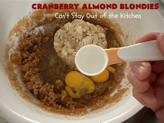 Cranberry Almond Blondies | Can't Stay Out of the Kitchen | these lovely #brownies simply explode with flavor. #AlmondExtract & #almonds in the #brownie & the #icing make them sing! #BrownedButter, #bananas, #DriedCranberries & #VanillaChips sweeten up the #blondies so they're rich, decadent & irresistible. Perfect for #holiday parties, #tailgating & #potlucks. #CranberryAlmondBlondies