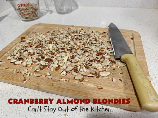 Cranberry Almond Blondies | Can't Stay Out of the Kitchen | these lovely #brownies simply explode with flavor. #AlmondExtract & #almonds in the #brownie & the #icing make them sing! #BrownedButter, #bananas, #DriedCranberries & #VanillaChips sweeten up the #blondies so they're rich, decadent & irresistible. Perfect for #holiday parties, #tailgating & #potlucks. #CranberryAlmondBlondies
