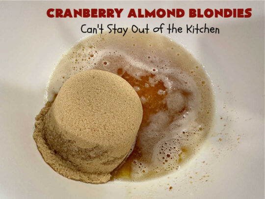 Cranberry Almond Blondies | Can't Stay Out of the Kitchen | these lovely #brownies simply explode with flavor. #AlmondExtract & #almonds in the #brownie & the #icing make them sing! #BrownedButter, #bananas, #DriedCranberries & #VanillaChips sweeten up the #blondies so they're rich, decadent & irresistible. Perfect for #holiday parties, #tailgating & #potlucks. #CranberryAlmondBlondies