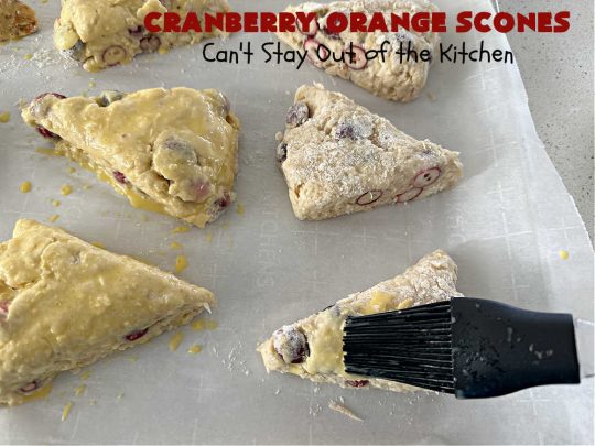 Cranberry Orange Scones | Can't Stay Out of the Kitchen | these luscious #scones have the most spectacular combination of flavors using fresh #cranberries, #OrangeZest & featuring a luscious #orange icing with more Orange Zest on top. They simply beg to be eaten! You'll be swooning after sinking your teeth into these amazing #CranberryOrangeScones. Great for a weekend, company or #holiday #breakfast or #brunch like #Thanksgiving, #Christmas, #NewYearsDay or #ValentinesDay.