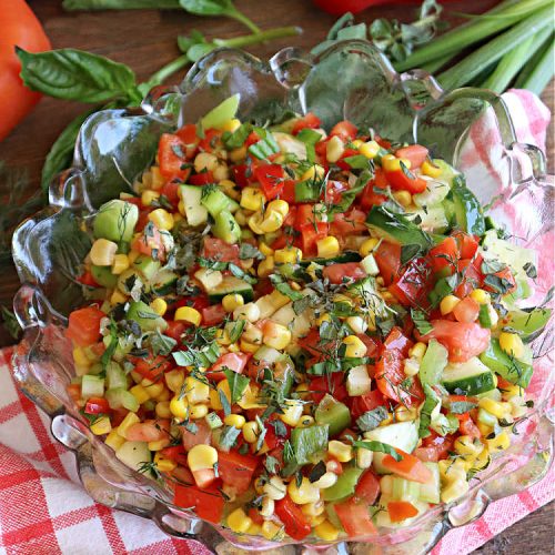 Fiesta Corn Salad | Can't Stay Out of the Kitchen | Enjoy this zesty #CornSalad for any #potluck, #BackyardBarbecue or when #grilling out with friends. It includes canned #corn, #tomatoes, #cucumber, #celery #BellPeppers & #Wishbone #LowFatItalianDressing. It's an easy-peasy #GlutenFree, #vegan #recipe that's terrific for hot, #summer days. #TexMex #salad #SideDish #FiestaCornSalad