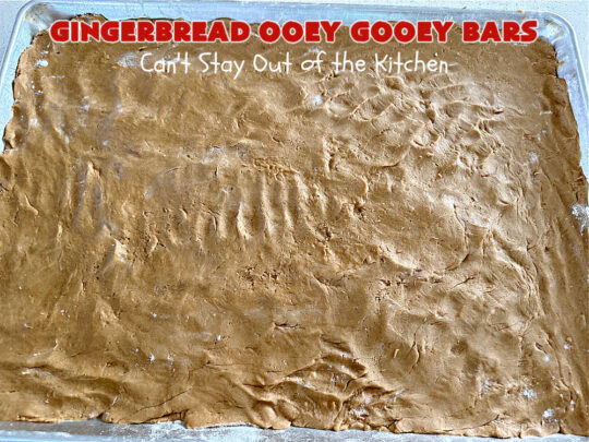 Gingerbread Ooey Gooey Bars | Can't Stay Out of the Kitchen | these delicious bar-type #cookies have all the classic flavors of #OoeyGooeyBars but with a #Gingerbread flavor instead! A #GingerbreadCakeMix is used for the crust layer. It's topped with a #CheeseCake layer, #WhiteChocolateChips & sprinkled with #PowderedSugar. Every bite will knock your socks off! Great for #Christmas or #holiday parties, #tailgating or a #ChristmasCookieExchange. #dessert #GingerbreadDessert #GingerbreadOoeyGooeyBars