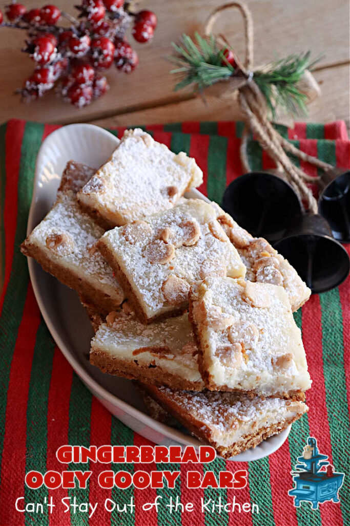 Gingerbread Ooey Gooey Bars | Can't Stay Out of the Kitchen | these delicious bar-type #cookies have all the classic flavors of #OoeyGooeyBars but with a #Gingerbread flavor instead! A #GingerbreadCakeMix is used for the crust layer. It's topped with a #CheeseCake layer, #WhiteChocolateChips & sprinkled with #PowderedSugar. Every bite will knock your socks off! Great for #Christmas or #holiday parties, #tailgating or a #ChristmasCookieExchange. #dessert #GingerbreadDessert #GingerbreadOoeyGooeyBars