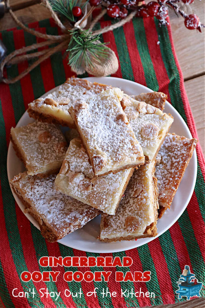 Gingerbread Ooey Gooey Bars | Can't Stay Out of the Kitchen | these delicious bar-type #cookies have all the classic flavors of #OoeyGooeyBars but with a #Gingerbread flavor instead! A #GingerbreadCakeMix is used for the crust layer. It's topped with a #CheeseCake layer, #WhiteChocolateChips & sprinkled with #PowderedSugar. Every bite will knock your socks off! Great for #Christmas or #holiday parties, #tailgating or a #ChristmasCookieExchange. #dessert #GingerbreadDessert #GingerbreadOoeyGooeyBars