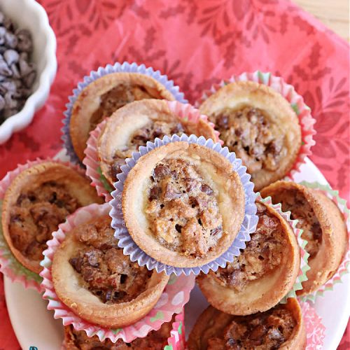 Gluten Free Chocolate Pecan Pies | Can't Stay Out of the Kitchen | these miniature #PecanPies are outstanding! They include miniature #chocolate chips to increase flavor & deliciousness. These fabulous #cookies can be made with #GlutenFree flour or regular flour--depending on your needs. Every bite will rock your world. Enjoy at #tailgating parties, potlucks or even #holiday #baking. #Christmas #PecanDessert #ChocolateDessert #GlutenFreeChocolatePecanPies