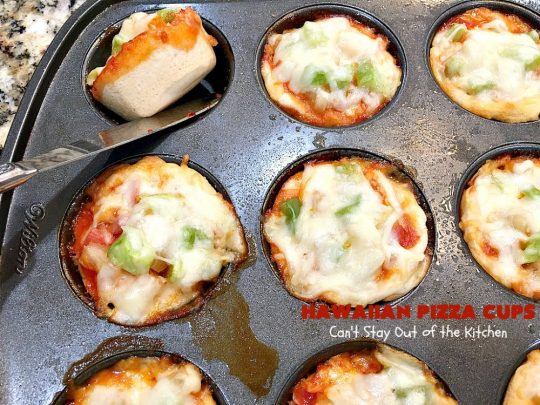 Hawaiian Pizza Cups | Can't Stay Out of the Kitchen | these fantastic miniature #pizzas are the best #appetizer of choice for #tailgating parties or the #SuperBowl! They're filled with spaghetti sauce, #ham, #pineapple & green bell pepper. Every bite is so mouthwatering, you'll be fighting others for the last one! #MozzarellaCheese #PillsburyRefrigeratedBiscuits #MiniaturePizzas #HawaiianPizzaCups