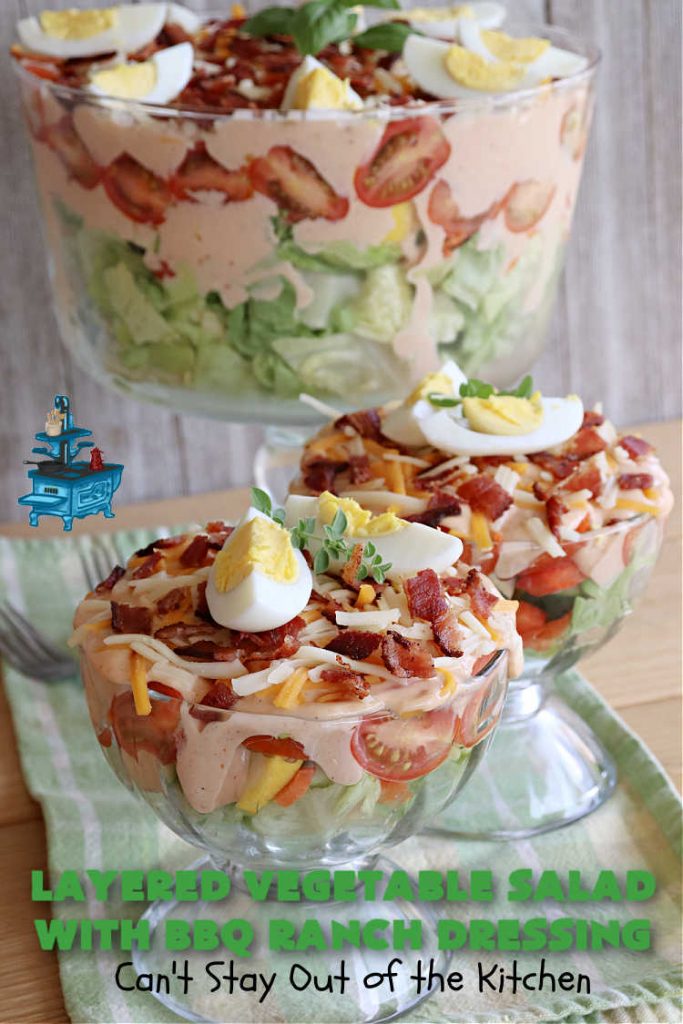 Layered Vegetable Salad with BBQ Ranch Dressing is spectacular! This amazing #salad uses all kinds of fresh #veggies, plus #bacon & two kinds of #cheese: #Cheddar & #MontereyJack. The #BBQRanchDressing is what gives the #recipe such amazing flavor. This #LayeredSalad is terrific for company or #holiday dinners & is #GlutenFree. #eggs #LayeredVegetableSaladWith BBQRanchDressing