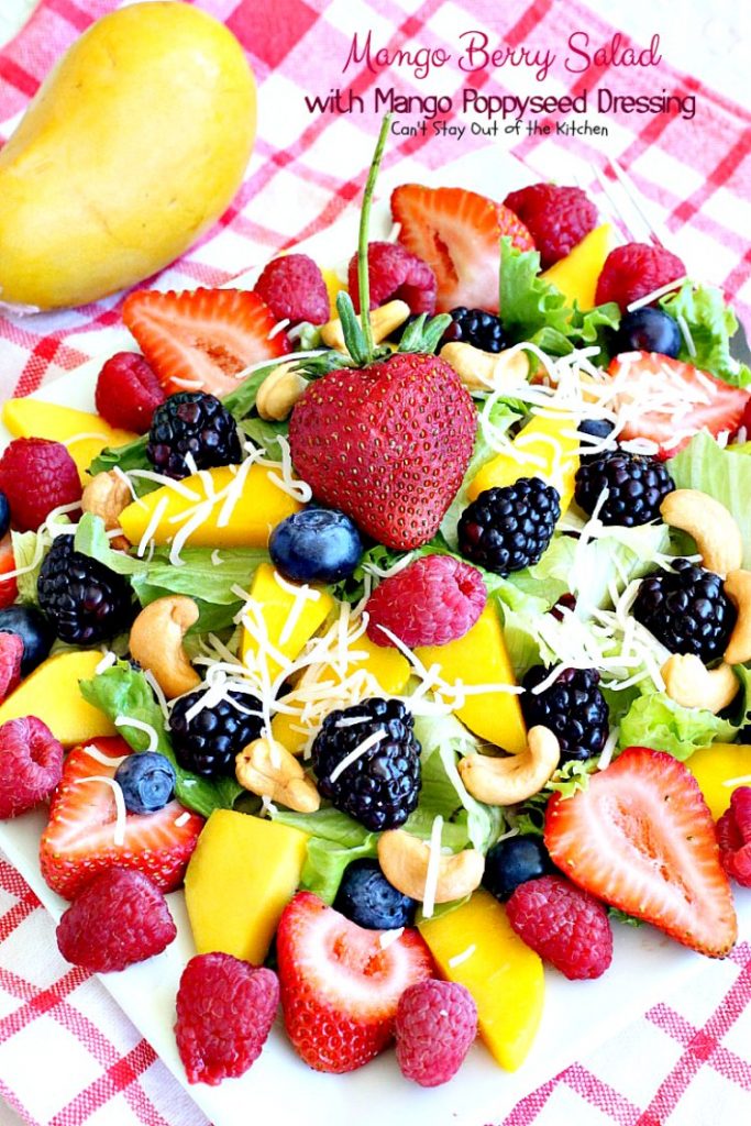 Mango Berry Salad with Mango Poppyseed Dressing | Can't Stay Out of the Kitchen | this amazing #salad has double the #mango flavor. Filled with #strawberries #raspberries #blueberries #blackberries & #swisscheese. We love this #salad. #glutenfree #cleaneating